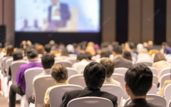 rear-view-audience-listening-speakers-stage-conference-hall-seminar-meeting-business-education-about-investment_41418-3462
