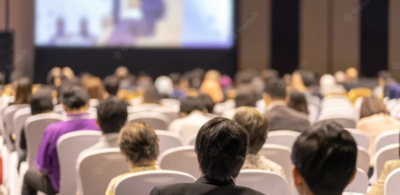 rear-view-audience-listening-speakers-stage-conference-hall-seminar-meeting-business-education-about-investment_41418-3462